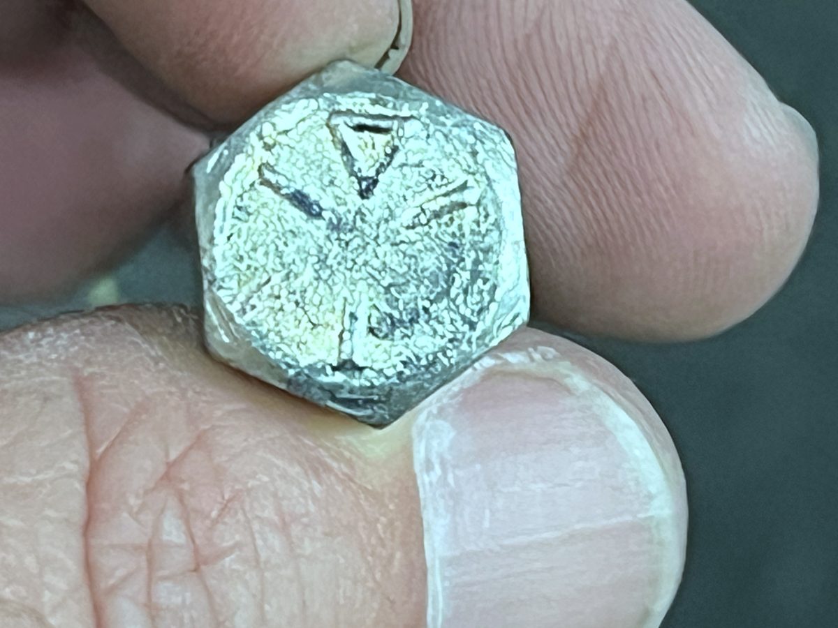Holding a worn part for identification at the Albert L. Crush Co. counter
